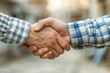 © Sviatoslav - Close-up Handshake Agreement in Urban Setting
