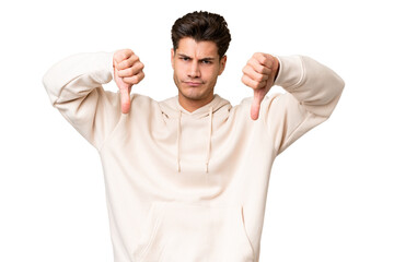 Wall Mural - Young caucasian handsome man over isolated background showing thumb down with two hands