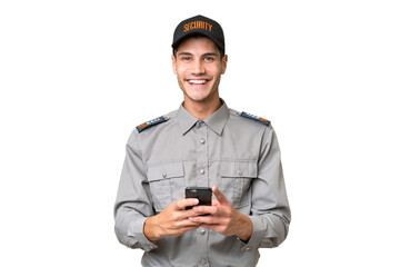 Wall Mural - Young security man over isolated background sending a message with the mobile