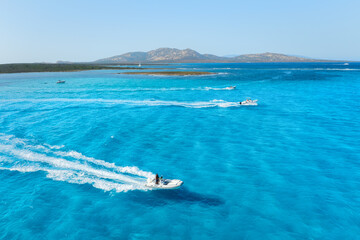 Wall Mural - vacation and leisure. aerial view on fast boat on blue mediterranean sea at sunny day. fast ship on 