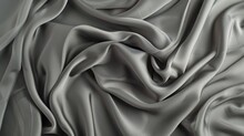 Elegant Grey Silk Fabric Flows With Rich Textures And Folds, Exuding A Sense Of Luxury And Sophistication In Close-up Detail