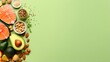 Fresh healthy food neatly arranged on a green background with space for text