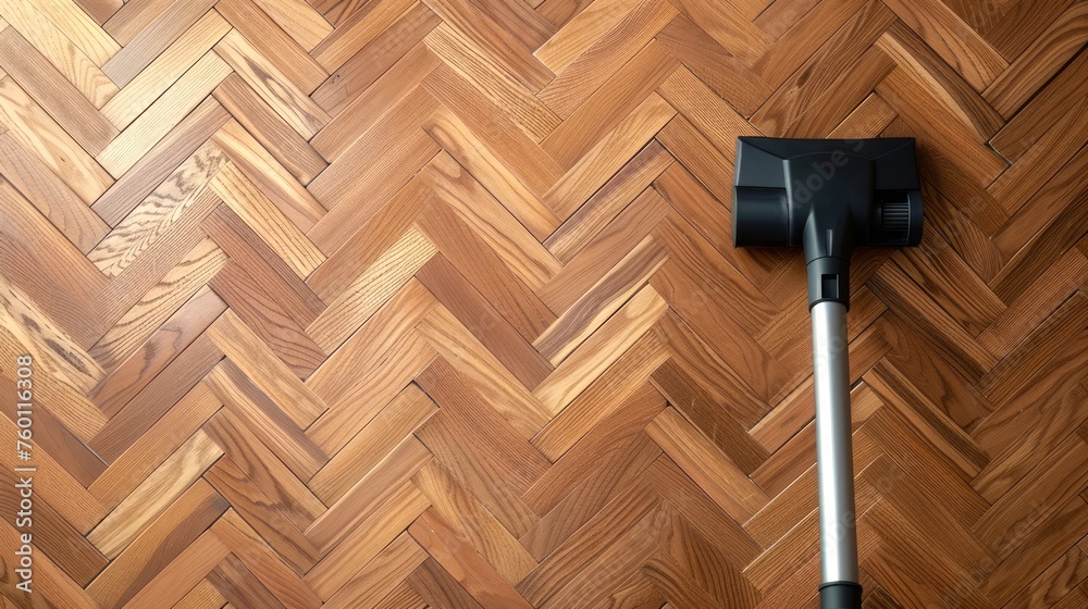 Vacuum cleaner head on herringbone pattern wooden floor. Household ...