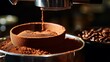 A macro shot of finely ground coffee being dispensed into a portafilter from an espresso machine