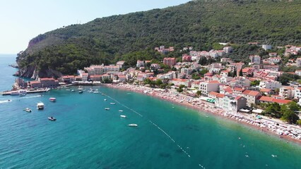 Wall Mural - Aerial view of Petrovac, old and modern city on Adriatic Sea coast. Center of Montenegrin tourism and popular sea resort.