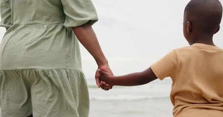 Canvas Print - Mom, child and holding hands on beach for support, bonding and holiday with waves. Back of parent, mother or family with kid by the ocean, sea or water in winter for love, care and safety or security