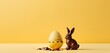 Yellow easter background with a chocolate easter bunny with copy space
