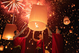 Fototapeta Miasta - Thai people release sky floating lanterns or lamp to worship Buddha's relics with reflection. Traditional festival in Chiang mai, Thailand. Loy krathong and Yi Peng Lanna ceremony. Celebration.