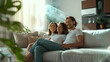 Happy family resting on sofa under air conditioner with air flow in living room. green clean air room concept