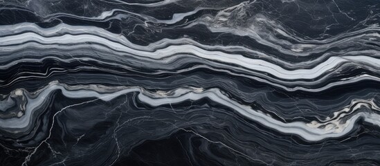 Sticker - A detailed view of a black and white marble texture resembling a landscape with patterns formed by water and wind waves. Monochrome photography showcasing the geology and rock formations