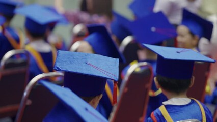 Wall Mural - Imagine an image showcasing a vibrant assembly of graduates and students, where everyone is donned in ceremonial blue gowns and caps, signifying their academic achievement This joyful gathering is a t