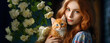 A young woman with red hair holding a ginger cat beside white roses, conveying companionship