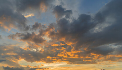 Wall Mural - Sunset sky. Abstract nature background. Dramatic blue with orange colorful clouds in twilight time.