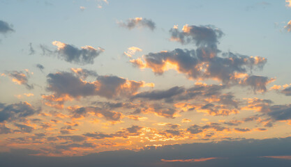 Wall Mural - Sunset sky. Abstract nature background. Dramatic blue with orange colorful clouds in twilight time.