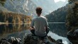 A person in meditation pose by a misty mountain lake, enveloped in the soft light of early morning.