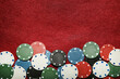 Poker chips on red table