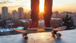 Close up of a young man's legs in jeans and red sneakers standing on a skateboard at sunset.