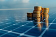 Money saved by using energy with solar panel, stack of coins on a photovoltaics panel (2)