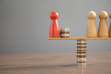 Wall Mural - Wooden human figure, coins on the table.