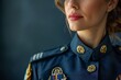 Confident female police captain in official dress uniform with decorated medals