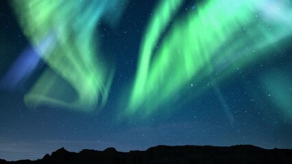 Wall Mural - Aurora Green and Starry Sky Over Canyon Tilt Down