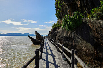 Wall Mural - The waterfront walkway along to the edge of the sea at Mu Ko Phetra