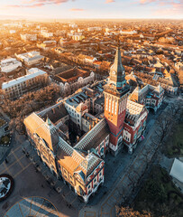 Wall Mural - Aerial view of a famous Subotica town hall as a symbol of the city history and architectural heritage, with its red facade and elegant clock tower drawing visitors and tourists to Serbia