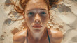 portrait of a girl in a swimsuit on the beach on the sand, face covered with freckles, tanned skin, sea wind breeze