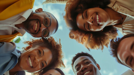 group of people standing in a circle and looking down into the camera