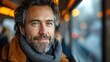 Charismatic man smiling on train journey - winter travel concept