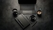 © ZeNDaY - Monochromatic black office desk setup featuring a laptop, smartphone, notebooks, and a coffee mug, ideal for modern professionals.