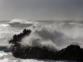 Wall Mural - Cliffs being hit by strong stormy sea waves