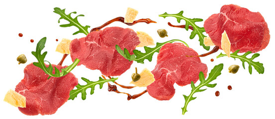 Wall Mural - Falling beef carpaccio ingredients isolated on white background