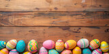 Fototapeta Panele - colorful painted easter eggs on  wood background. Easter frame of eggs painted in blue red yellow pink green colorful color. Flat lay, top view. Copy space for text