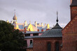 Roofs and spires of old town Riga buildings on the sunset