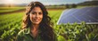 A young hispanic farmer woman on farm fields with solar panels on the side for green renewable energy banner copyspace from Generative AI