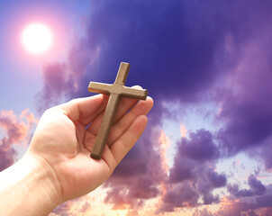 Wall Mural - Cross in arm at sunset. Good Friday concept. 3d illustration