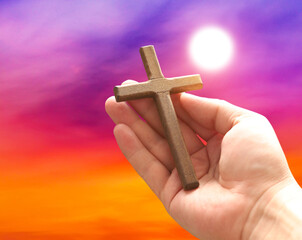 Wall Mural - Cross in arm at sunset. Good Friday concept. 3d illustration