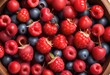 Plump, juicy red berries arranged in a rustic wooden bowl, their vibrant hues captured in stunning high-definition detail, tempting the viewer's taste buds