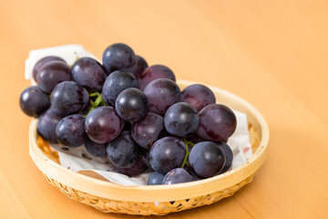 Wall Mural - Ripe blue grape on the basket