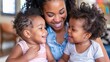 African American Mother Laughing with Twin Toddlers