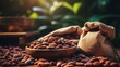 Cocoa beans harvested in a burlap sack on a wooden table with blurred crop farming background
