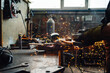 © Zamrznuti tonovi - Grinding machine grinding the metal plate while the golden sparks fly.