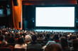 © zphoto83 - Rear view of auditorium looking at big screen on business conference