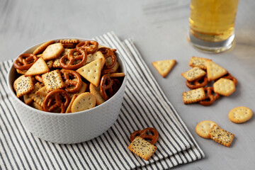 Wall Mural - Homemade Cracker Snack Mix with Pretzels in a Bowl, side view.