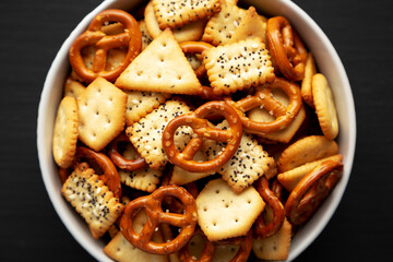 Wall Mural - Homemade Cracker Snack Mix with Pretzels in a Bowl, top view.