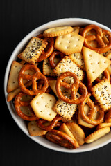 Wall Mural - Homemade Cracker Snack Mix with Pretzels in a Bowl, top view.