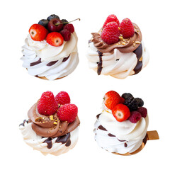 Wall Mural - Vanilla and chocolate mini pavlova cakes with whipped cream decorated with fresh berries, isolated on white background, png.