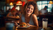 happy woman while eating a hamburger, happy woman at restaurant