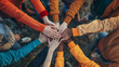 © Kateryna - An energetic team huddle, hands together in the center, signifying unity and motivation, business persons, with copy space